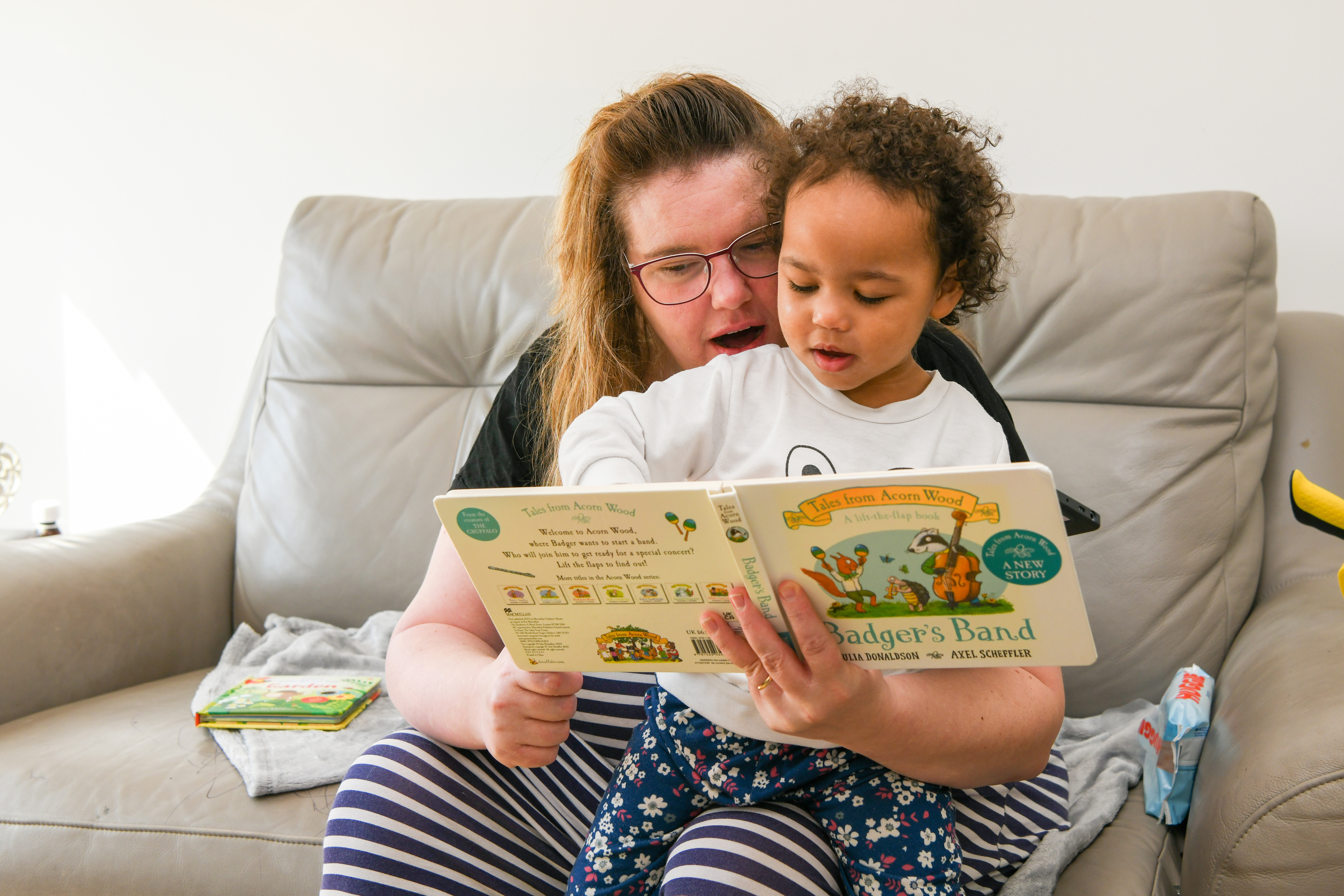 woman and child reading book
